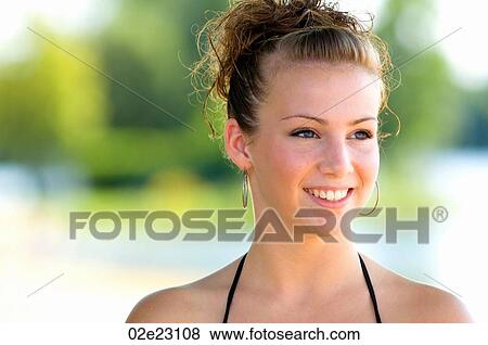 Stock Photo - Portrait of teenage girl on beach.. Fotosearch