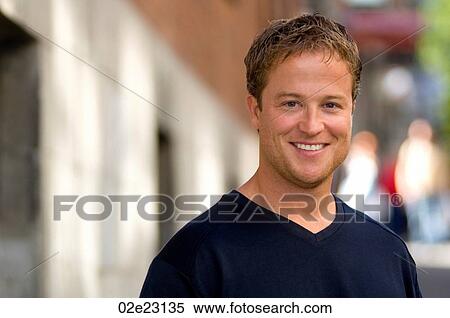 Portrait of young smiling man outdoors. View Large Photo Image Stock Photography - Portrait of young smiling man outdoors.. Fotosearch