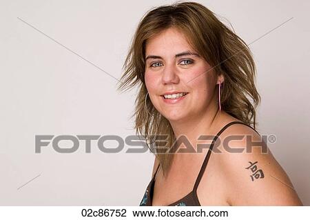 Portrait of young woman with tattoo. View Large Photo Image Stock Image - Portrait of young woman with tattoo.. Fotosearch
