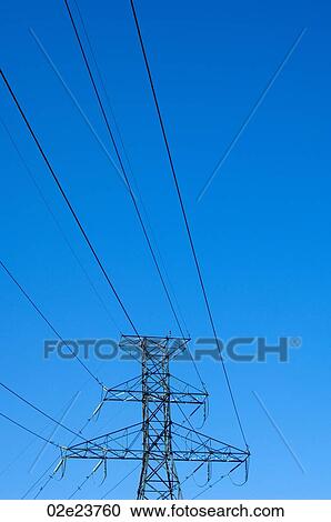 Power lines against blue sky. View Large Photo Image Stock Image - Power lines against blue sky.. Fotosearch