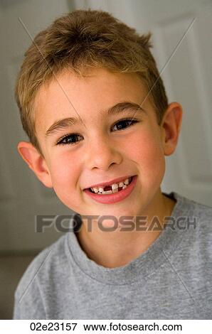 Proud young boy with missing front teeth. View Large Photo Image Stock Photo - Proud young boy with missing front teeth.. Fotosearch