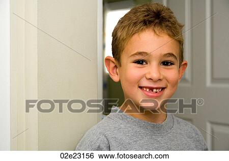 Proud young boy with newly lost teeth. View Large Photo Image Stock Photograph - Proud young boy with newly lost teeth.. Fotosearch