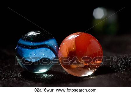 Stock Photography - Red and blue marbles. Fotosearch