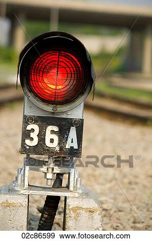 Red safety warning light beside train railway tracks. View Large Photo Image Stock Photo - Red safety warning light beside train railway tracks.. Fotosearch