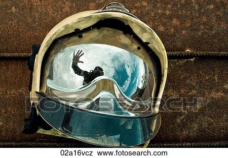 Stock Photo - Reflection in a visor of a man waving . Fotosearch