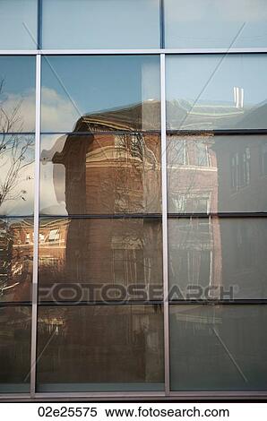 Stock Photography - Reflection in a window on Harvard University campus in Boston, Massachusetts, USA. Fotosearch
