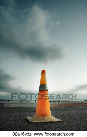 Road cone on tarmac View Large Photo Image Stock Photo - Road cone on tarmac. Fotosearch
