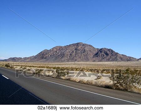 Road through the desert, view of the mountain View Large Photo Image Stock Image - Road through the desert, view of the mountain . Fotosearch