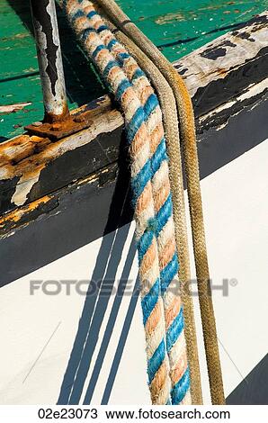 Ropes tied to peir from fishing boat. View Large Photo Image Stock Image - Ropes tied to peir from fishing boat.. Fotosearch