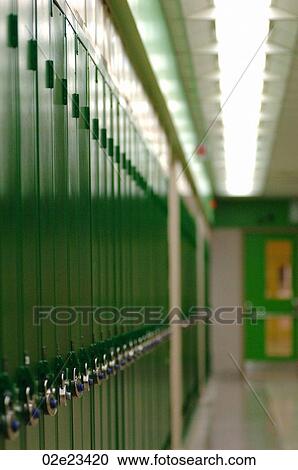 Stock Image - Row of green school lockers in hallway.. Fotosearch