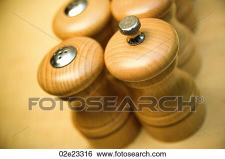 Stock Photograph - Row of salt and pepper shakers.. Fotosearch