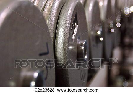 Row of weights in fitness club. View Large Photo Image Stock Photo - Row of weights in fitness club.. Fotosearch