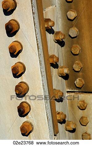 Rusted nuts and bolts affixed on building. View Large Photo Image Stock Photo - Rusted nuts and bolts affixed on building.. Fotosearch