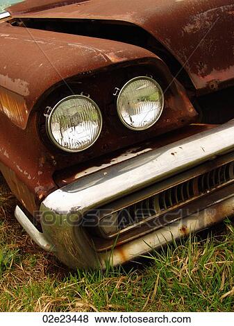 Stock Photo - Rusty old abandoned car.. Fotosearch