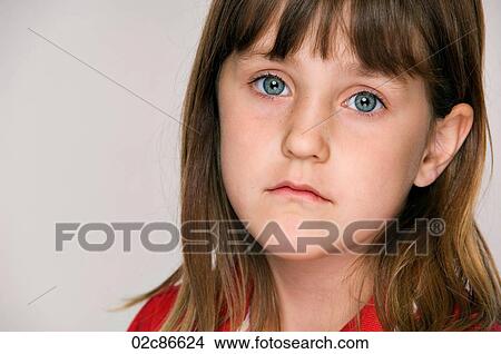 Sad face of young six year old girl. View Large Photo Image Picture - Sad face of young six year old girl.. Fotosearch