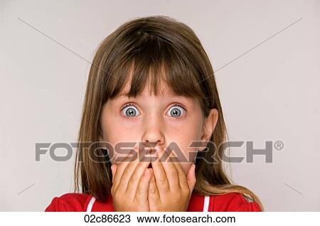 Scared six year old girl with hands covering mouth. View Large Photo Image Stock Image - Scared six year old girl with hands covering mouth.. Fotosearch