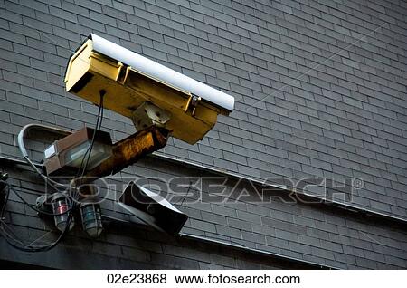 Security camera mounted on urban brick wall. View Large Photo Image Stock Photo - Security camera mounted on urban brick wall.. Fotosearch