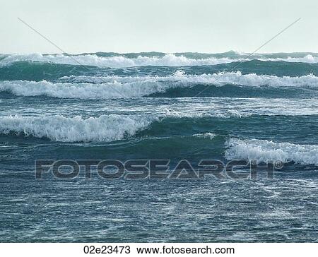 Series of powerful coastal waves crashing to shore. View Large Photo Image Stock Image - Series of powerful coastal waves crashing to shore.. Fotosearch
