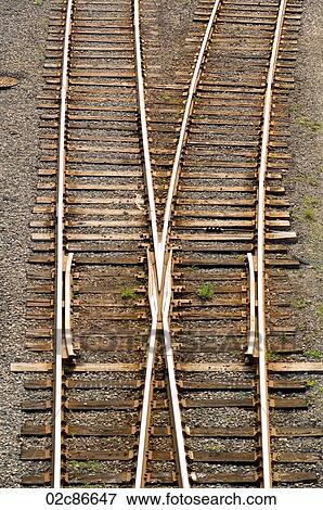 Stock Photo - Set of two converging train tracks.. Fotosearch