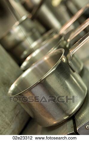 Several steel cooking pots in gourmet kitchen. View Large Photo Image Stock Image - Several steel cooking pots in gourmet kitchen.. Fotosearch