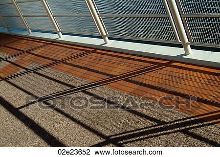 Shadow of a hand rail on a sidewalk. View Large Photo Image Stock Image - Shadow of a hand rail on a sidewalk.. Fotosearch