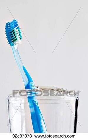 Single blue toothbrush in bathroom toothbrush holder. View Large Photo Image Stock Image - Single blue toothbrush in bathroom toothbrush holder.. Fotosearch
