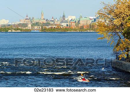 Stock Image - Single kayaker in Ottawa River, Canada.. Fotosearch