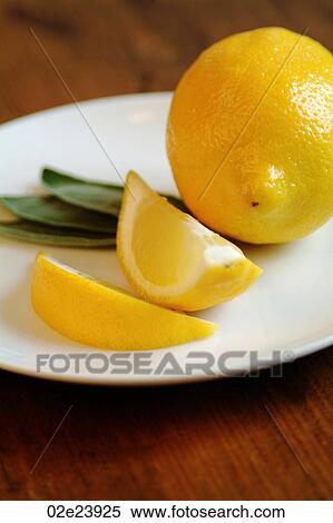 Sliced lemon with mint on white plate. View Large Photo Image Stock Photography - Sliced lemon with mint on white plate.. Fotosearch