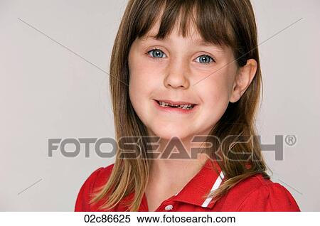 Smiling young six year old girl with missing teeth. View Large Photo Image Stock Photography - Smiling young six year old girl with missing teeth.. Fotosearch