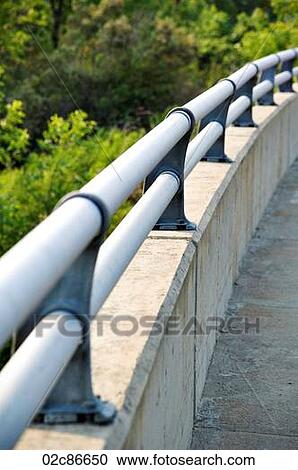 Smooth curving bridge handrail. View Large Photo Image Stock Image - Smooth curving bridge handrail.. Fotosearch