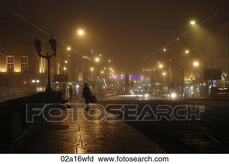 Solitary figure on bridge in Cork by night, Ireland View Large Photo Image Stock Image - Solitary figure on bridge in Cork by night, Ireland. Fotosearch