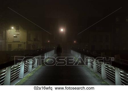 Solitary figure on Shandon bridge in Cork by night, Ireland View Large Photo Image Stock Photography - Solitary figure on Shandon bridge in Cork by night, Ireland. Fotosearch