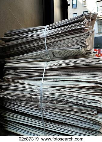Stock Photo - Stack of daily business newspapers.. Fotosearch