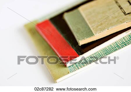 Stock Image - Stack of old vintage receipt books on white background.. Fotosearch