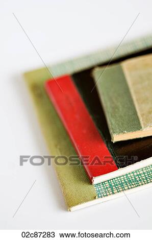Stock Image - Stack of old vintage receipt books on white background.. Fotosearch