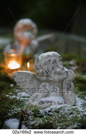 Statue of a cherub View Large Photo Image Stock Image - Statue of a cherub. Fotosearch