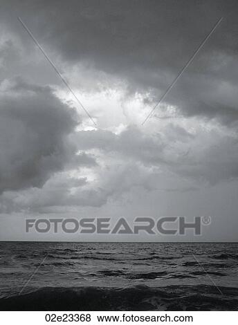 Storm clouds over the ocean. View Large Photo Image Stock Photo - Storm clouds over the ocean.. Fotosearch