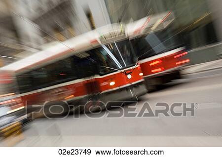 Street cars moving through a city street. View Large Photo Image Stock Photo - Street cars moving through a city street.. Fotosearch
