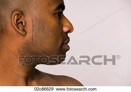 Stock Photo - Strong stoic profile of African-American man.. Fotosearch