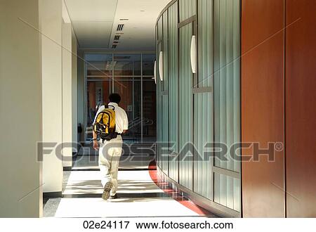 Student walking down hallway, Carleton University, Ottawa Canada. View Large Photo Image Stock Photo - Student walking down hallway, Carleton University, Ottawa Canada.. Fotosearch