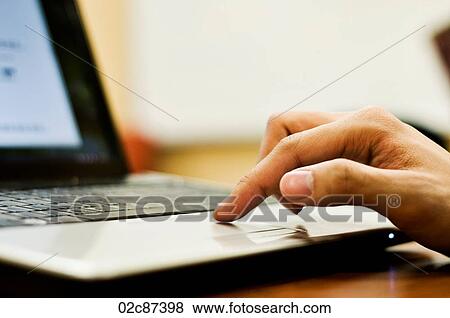 Student's finger on trackpad of computer. View Large Photo Image Stock Photo - Student's finger on trackpad of computer.. Fotosearch