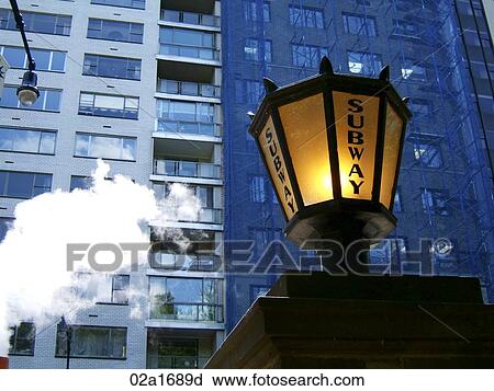 Subway sign in the city, steam blowing (horizontal) View Large Photo Image Stock Image - Subway sign in the city, steam blowing (horizontal). Fotosearch