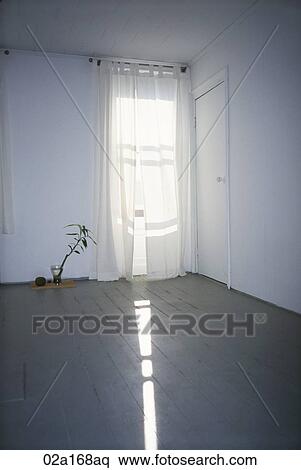 Sun shining through the curtain in an empty room View Large Photo Image Stock Photography - Sun shining through the curtain in an empty room. Fotosearch