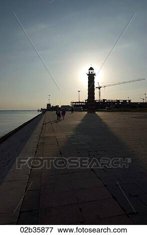 Sunset over beachside promenade View Large Photo Image Stock Photo - Sunset over beachside promenade. Fotosearch