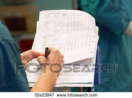 Surgeon's hands holding chart. View Large Photo Image Stock Photo - Surgeon's hands holding chart.. Fotosearch