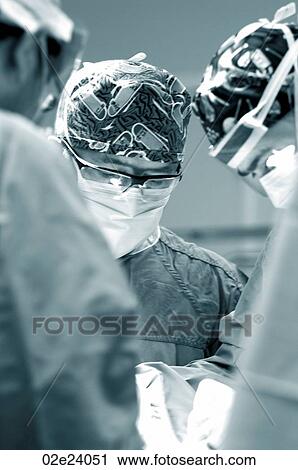 Surgeons operating on patient in OR. View Large Photo Image Stock Image - Surgeons operating on patient in OR.. Fotosearch