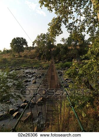 Suspension bridge and stream Kenya Africa View Large Photo Image Stock Photograph - Suspension bridge and stream Kenya Africa. Fotosearch