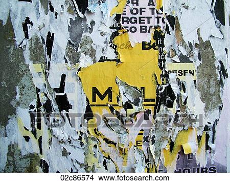 Tattered posters on a pole. View Large Photo Image Picture - Tattered posters on a pole.. Fotosearch