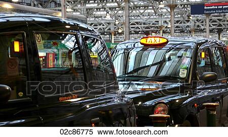 Taxi cabs waiting at Edinburgh train station, UK. View Large Photo Image Stock Photography - Taxi cabs waiting at Edinburgh train station, UK.. Fotosearch