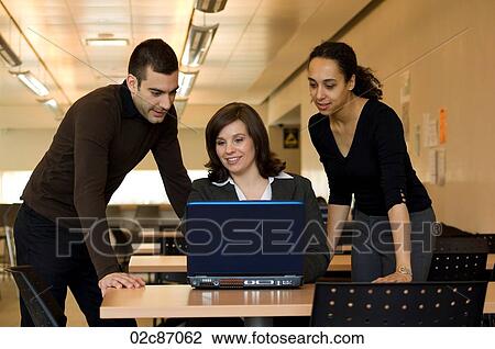 Team of office workers working together. View Large Photo Image Stock Image - Team of office workers working together.. Fotosearch